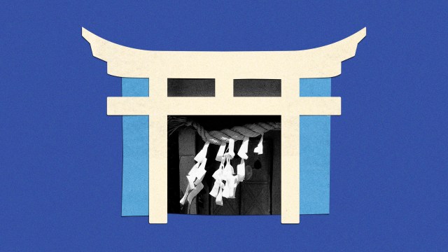 A Shinto Torii gate with Shimenawa prayers.